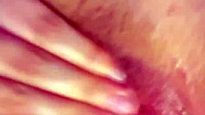 curvy latina fingers fat wet pussy lips and rubs huge clit up close