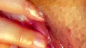 curvy latina fingers fat wet pussy lips and rubs huge clit up close