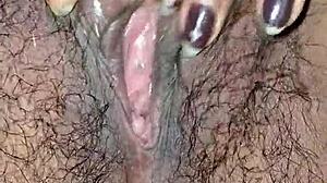 desi housewife's juicy hairy pussy lips up close while she moans and masturbates wet?