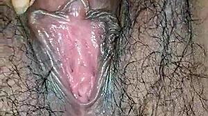 desi housewife's juicy hairy pussy lips up close while she moans and masturbates wet?