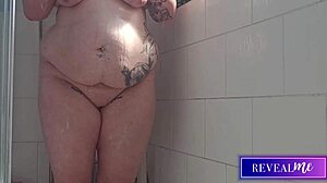 Curvy babe fingers her wet pussy in steamy shower jet play