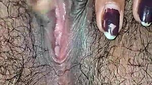 desi housewife's juicy hairy pussy lips up close while she moans and masturbates wet?