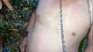 mistress kantalis unleashes chained slave ebed amid forest shadows