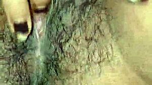 desi housewife's juicy hairy pussy lips up close while she moans and masturbates wet?