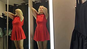 Blonde wife flashes big tits in see-through lingerie at mall changing room.