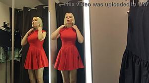 Blonde wife flashes big tits in see-through lingerie at mall changing room.
