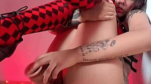 Harlequin babe teases her smooth shaved pussy with toys and fingers