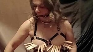 french housewife bound in leather harness flashes and auto-sessions with mouth gag outdoors