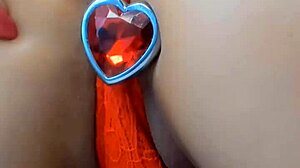 this hot brunette goddess teases her huge tits with titty fuck then plugs that extreme ass