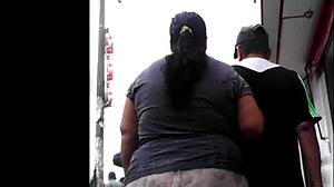 A peruvian woman shops casually through the market