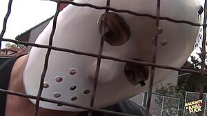 Who's wrecking this busty blonde's asshole with masked gangbang?