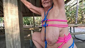 curvy british granny bound in silk flashes saggy tits and trimmed pussy outdoors