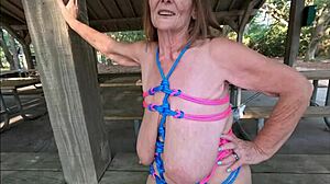 curvy british granny bound in silk flashes saggy tits and trimmed pussy outdoors