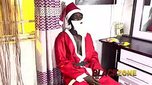 Cute ebony babe unwraps Santa's teasing bedroom gift