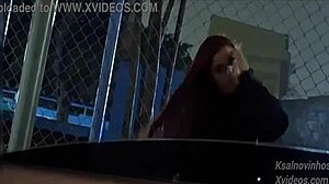 giving this hot teen risky handjob in public street car