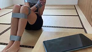 Redhead's Sexy Feet Exposed While Bound and Duct-Taped Tight