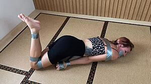 Redhead's Sexy Feet Exposed While Bound and Duct-Taped Tight