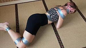 Redhead's Sexy Feet Exposed While Bound and Duct-Taped Tight