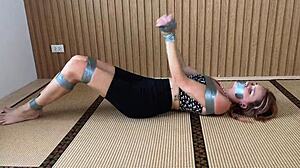 Redhead's Sexy Feet Exposed While Bound and Duct-Taped Tight