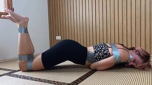 Redhead's Sexy Feet Exposed While Bound and Duct-Taped Tight