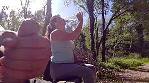 exhibitionist babe seduces curvy milf for outdoor suck fuck facial in park