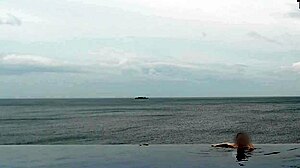 the cute college princess dips her ponytail legs into infinity pool teasing softcore feet fetish