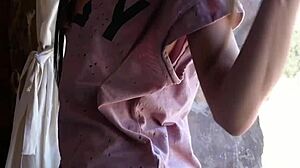 Petite brunette teen sways hips stripping clothes in teasing dance routine