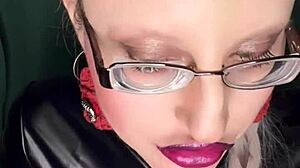 sissy slut kisses glossy lips while stroking in pink panties glasses