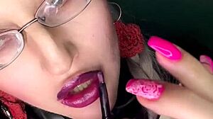 sissy slut kisses glossy lips while stroking in pink panties glasses