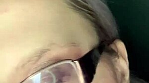 sissy slut kisses glossy lips while stroking in pink panties glasses