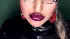 sissy slut kisses glossy lips while stroking in pink panties glasses