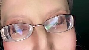 sissy slut kisses glossy lips while stroking in pink panties glasses