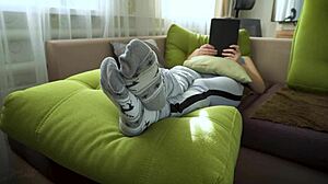 Amateur girl slowly teases her wrinkled socks and bare feet up close