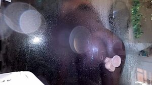 ebony milf slips into shower with new toy and someone peeks in curiously