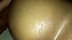 Teen ebony stretches her ass wide with huge black anal dildo close up