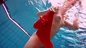 sexy tight-pussy teen avenna dives naked into the pool showing off her shaved nude twat underwater