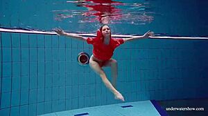 sexy tight-pussy teen avenna dives naked into the pool showing off her shaved nude twat underwater