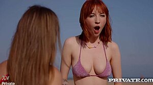 Lilly Mays' redhead body gets licked spanked and fucked on beach