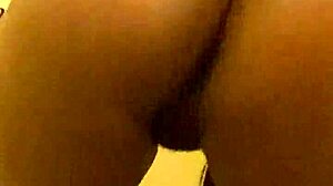 Sexy Ebony Brunette with Bangs Spreads Legs Close-Up Pissing Stream from Shaved Pussy