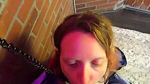 skinny milf chained to wall on knees gagging on cock with pierced nipples exposed