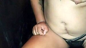 Latina puta sucks huge cock through glory hole. Horny tattooed whore gives sloppy homemade blowjob.