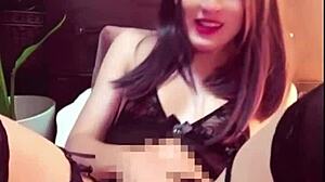Quiet crossdressing beauty with long black hair masturbates alone in public toilet.