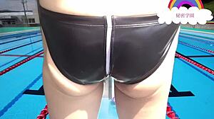 Schoolgirl slips into latex swimsuit for secret pool handjob fetish outdoors