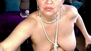 Charming mature whore self-fists juicy shaved pussy close-up!