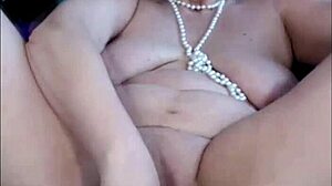 Charming mature whore self-fists juicy shaved pussy close-up!