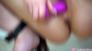 lambie bloom teases her shaved pussy then fucks it with purple toy up close