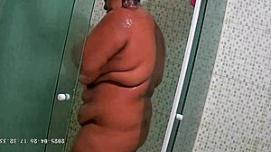 Hidden camera catches busty bbw neighbor shaving her big ass and natural tits