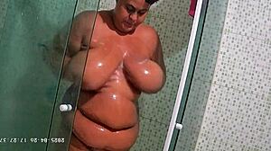 Hidden camera catches busty bbw neighbor shaving her big ass and natural tits