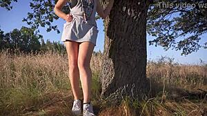 girl in short skirt flashes full back panties teasing outdoors