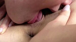 blonde licks blue eyed girl's vagina up close